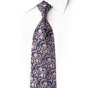 San-Dee men's 100% silk necktie in midnight navy with all-over baroque floral scroll jacquard in rose gold and blush tones, with hand-applied crystal rhinestone accents tracing the vine pattern – front knotted view on white dress shirt