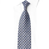 San-Dee navy blue geometric medallion rhinestone silk necktie knotted on white dress shirt showing full blade with gold and silver crystal rhinestone accents