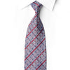 San-Dee EC139 silk necktie knotted against a white shirt, with silver-gray geometric motifs, crimson diagonal stripes and sparkling rhinestones.