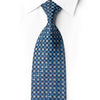 Rolled San-Dee navy silk necktie with blue and silver geometric floral motifs, blue crystal rhinestones and silver sparkles.