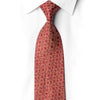 San-Dee crimson silk necktie knotted against a white shirt, featuring gold-toned geometric squares and sparkling crystal rhinestones.