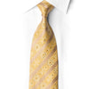 Close-up of a knotted champagne and gold floral stripe silk tie with crystal rhinestones against a white shirt.