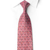 San-Dee crimson silk necktie knotted against a white shirt, with silver scroll medallions and crystal rhinestone accents.