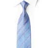 Rolled San-Dee icy blue silk tie with a miniature checkerboard pattern, diagonal crystal rhinestone trails and silver sparkles.